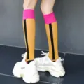 Fashion women mid-calf socks with contrast color striped design and chunky sneakers. - One Size / Snow - Yellow Vertical Stripes