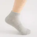 Close-up of breathable mesh short socks in light gray, showing fine knit texture and ankle fit. - One Size / Light Gray