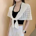 Detail display of the white knitted hollow sun protection shawl and stylish summer cape. - White