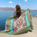 Boho beach shawl with vibrant geometric baroque print and tassels, perfect for outdoor travel. - Green Blue Totem