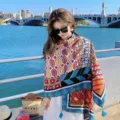 Detailed view of bohemian ethnic geometric printed tassel shawl, outdoor beach resort style. - Hexagon Totem