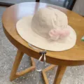 Kids beige bucket hat with pink lace bow, adjustable chin strap, cute sun protection detail. - 48-54CM / Beige