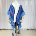 Multicolor chevron knit cape with cozy white faux fur collar and playful fringe tassels. - Blue Purple