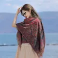 Ethnic style fringed shawl detail shot, retro patterned cape outdoor wearing scene. - YF356 Pink