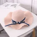 Pink straw sun hat detail, large brim with navy blue bow, perfect for summer beach and travel. - Adult M / Light Pink