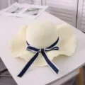 Women summer beach sun hat with bow, wide brim straw hat for vacation and daily travel. - Adult M / Creamy White