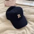 Classic navy blue baseball cap with embroidered letter R detail, casual cotton sun hat. - Navy Blue