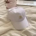 Korean style white baseball cap for women featuring embroidered letter R stylish design. - White