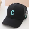Kids black mesh baseball cap featuring green C letter embroidery and cute side cartoon design. - 54cm / Mesh C Letter Style / Black