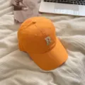 Orange baseball cap with white embroidered letter R, stylish casual sun hat for women and girls. - Bright yellow