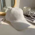 Plain white baseball cap for women, classic dad hat style, stylish and versatile casual headwear. - White