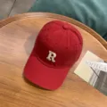 Classic red washed cotton baseball cap featuring embroidered letter R variant style - Adjustable / Burgundy