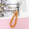 Braided leather keychain with metal clasp and ring, bright orange strap for keys. - Wrapped Leather Cord / Orange