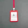 Red plastic ID badge holder with lanyard and card insert for school office work events. - With Lanyard / Red