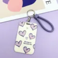 Purple heart pattern card holder with braided wrist strap and metal keyring accessory. - Beige Line Heart / Purple Edged Hand Rope