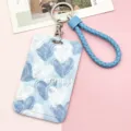 Portabadge con motivo a cuori blu, cordino intrecciato e portachiavi ad anello variante. - Motivo a Cuore Con Corda in Pelle Bordata Blu Chiaro / Blu