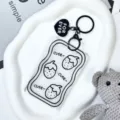 Transparent card sleeve keychain with cute strawberry print and black heart pendant. - Strawberry Style / Black Heart Keychain