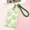 Simpatico porta carte in plastica con motivo a cuore verde, portachiavi e cinturino. - Motivo a Cuore Con Corda in Pelle Bordata Verde / Verde