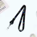 Black retractable badge reel lanyard with colorful monster eyes text design for ID badge cards. - Black "See You" (English Letters "See You")