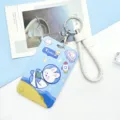 Cute cartoon astronaut sliding card holder with braided wrist strap and keychain. - Floating Astro Rabbit with White Edged Leather Cord