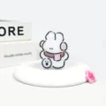 Cute white cartoon dog phone grip holder, rotatable and foldable acrylic mobile stand. - Pink Scarf Rabbit
