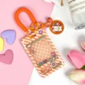 Cute cartoon claw machine transparent card sleeve with spring strap for student ID pass. - Orange Grid Game Console with Matching Spring Rope (Orange Rabbit Bell Clasp) / Orange