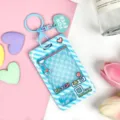 Blue claw machine transparent card holder ID badge sleeve with cute keychain accessory. - Blue Grid Game Console with Blue Heart Keychain