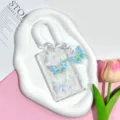 Clear butterfly ID card holder with coiled lanyard and pendant for students and school use. - Gradient Blue Butterfly + White Spring Rope