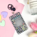 Transparent acrylic card holder with retractable reel and claw machine design for daily use. - Black Grid Game Console + Black Bell Lobster Clasp