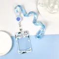 Cute transparent ID card holder with blue lanyard, retractable reel and milk cow pattern. - Big Head Cow With Strawberry Cat Extendable Lanyard / Sliding Transparent / Blue Smiley Accessory