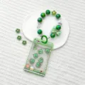 Green claw machine shaker card holder with beaded lanyard strap transparent student ID badge case. - Green Claw Machine Dinosaur Shaking / Sliding Transparent (Colorful Green Bow)