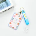 Transparent ABS sliding card holder with blue lanyard and floral pattern for students daily use. - Blue Border English Flower Frame / Blue Flower Keychain