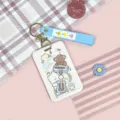 Cute cartoon student card holder with silicone strap and musical bear pattern protective cover. - White Guitar Cat + Blue Flower Keychain