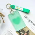 Green transparent student ID card holder with silicone strap and keychain for daily use. - Green Heart (With Green Flower Keychain)