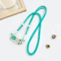 Cute cartoon dinosaur acrylic mobile phone lanyard strap with adjustable white beads for everyday use. - Turquoise Green