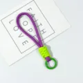 Short braided wrist lanyard for phone cases and keys, purple and neon green strap. - Violet Lime