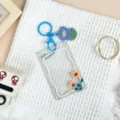 Clear acrylic sliding card sleeve with blue floral keyring and cute pendant for student IC cards. - Sunflower / Blue Flower Keychain