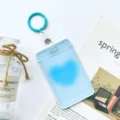 Light blue transparent ID card holder with keychain, clear student bus pass protector case. - Blue Heart (With Blue Strap Keychain)
