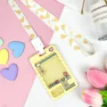 Cute cartoon transparent card holder with claw machine pattern and matching lanyard for daily use. - Yellow Grid Game Console with Japanese Pear Snap Long Lanyard