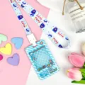 Cute cartoon student ID card holder with matching lanyard, clear transparent badge sleeve. - Blue Grid Game Console with Blue One-Eyed Monster Snap Long Lanyard