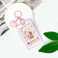 Portacarte rigido trasparente con simpatico portachiavi per tessere studentesche e abbonamenti. - Fumetto Stella - Griglia Rosa Floreale / Portachiavi a Cuore Rosa / Rosa