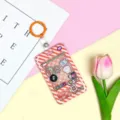 Creative claw machine cardholder with cute animal charms, student ID badge protector sleeve. - 3.3 Orange Leather Keychain / Orange Grid Console