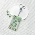 Cute claw machine ID card holder with retractable reel keychain clear student bus card cover - Green Claw Machine Dinosaur Shaking / Transparent Sliding Cover + White Retractable Buckle (Little Dinosaur)