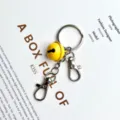 Candy-colored cute bell keychain with dual lobster clasps, perfect for bags and keys. - Yellow