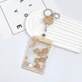 Cute cartoon bear claw machine ID card holder with retractable badge reel and keychain strap - Orange Claw Machine Milk Tea Bear Shaking / White Easy-Pull Buckle (Milk Tea Bear Acrylic)