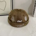 Distressed denim docker cap detail showing embroidery and ripped design for streetwear. - M (56-58cm) / Khaki