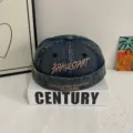 Detailansicht der Vintage Waschung Denim Docker Cap, trendige Mütze mit Umschlag und Stickerei. - M (56-58cm) / Grau