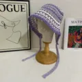Handmade purple and white crochet bucket hat detail showcasing hollow pattern and long ties. - M (56-58cm) / Purple