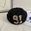 Black docker cap detail, retro number 91 embroidery, streetwear fashion trendy skull cap. - M (56-58cm) / Black