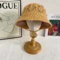 Close-up view of the handmade straw crochet bucket hat, showing fine woven texture and chin strap. - M (56-58cm) / Khaki
